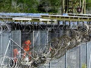 US Army MP (R top) watches over detainees, 26 Janu